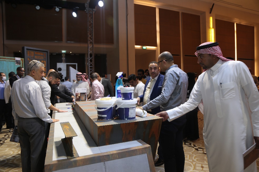 A group of people standing around a table with food on it

Description automatically generated with medium confidence