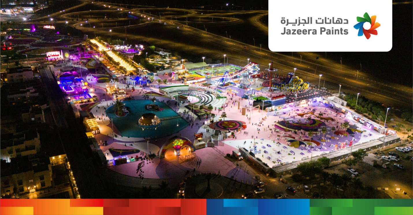 An aerial view of a city at night

Description automatically generated